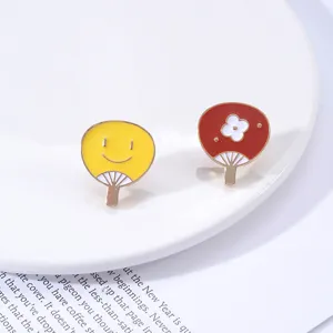 Cute enamel pins set featuring smiley face and flower folding fan designs, alloy brooch badge.