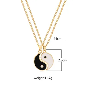 Detail view of the golden double chain yin yang pendant necklace, showing precise size.