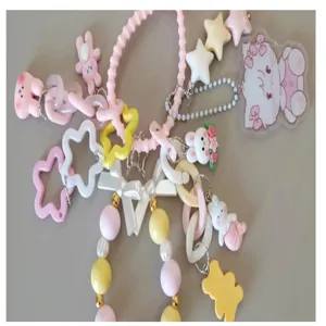 Cute pastel acrylic bead phone charm and cartoon keychain accessories for DIY jewelry crafting.