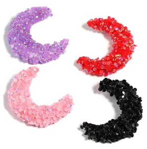 Close-up of colorful crescent moon resin rhinestone beads, perfect for DIY jewelry making.