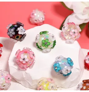 Colorful DIY acrylic flower beads with rhinestones for phone charms and jewelry making.