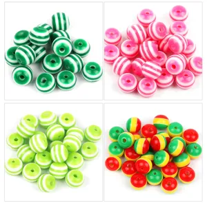 Close up of colorful candy striped resin loose beads for DIY bracelet jewelry making accessories.