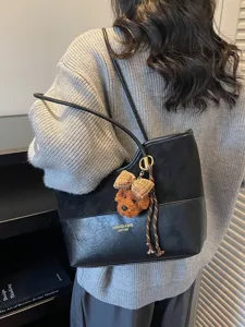 Vintage black patchwork tote bag for women with large capacity and cute charm detail