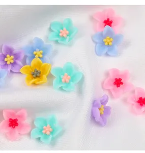 Colorful resin flowers 5-petal charms for nail art and phone case DIY accessories detail shot.