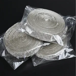 Rhinestone ribbon detail shot showing close-up of sparkling crystal mesh drill strip rolls.
