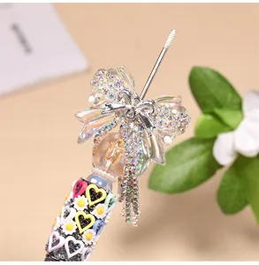 Handmade rhinestone bow tassel bead charm detail, exquisite crystal pendant for phone or bag.