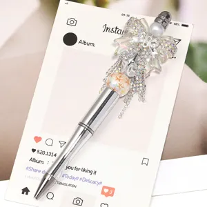Luxury rhinestone bow decorative ballpoint pen, elegant beaded metal pen for creative writing.