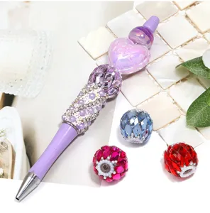 DIY beaded pen and sparkling rhinestone crystal spare beads, luxury detailed accessory showcase.