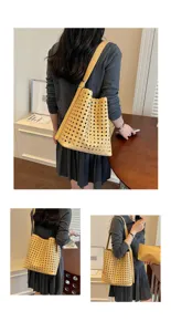 Vue de détail du sac cabas tressé en cuir souple, grand sac à épaule élégant pour femme.