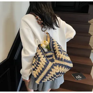 Large capacity woven straw shoulder bag, stylish blue tote for summer beach vacation.