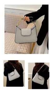 Détail de sac porté épaule pour femme, texture monogramme chic et bandoulière chaîne.