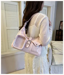 Pink glossy shoulder bag with clear front pockets, stylish niche design cross body bag for daily wear.