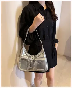 Metallic silver shoulder bag with clear front pocket trendy crossbody hobo bag for women.