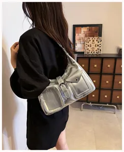 Metallic silver shoulder bag detail view, showing transparent card pocket and buckle design.