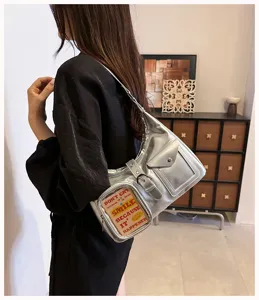 Silver metallic shoulder bag with transparent pocket, trendy fashion crossbody bag.