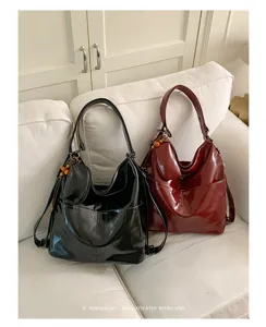 Glossy PU leather shoulder bag detail, elegant retro hobo design with versatile daily use.