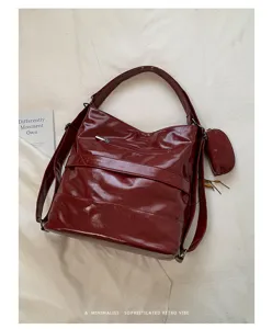 Red PU leather convertible shoulder bag backpack with front zipper pocket and mini pouch.