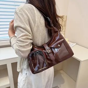 Stylish dark brown patent leather shoulder bag with clear window pockets for daily use.