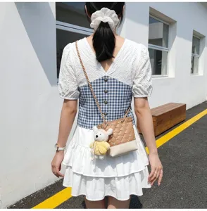 Korean style chic small bucket bag with diamond studs, chain strap and cute plush bear pendant.