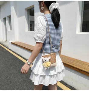 Korean style stylish quilted chain bucket bag with cute bear pendant for women daily use.