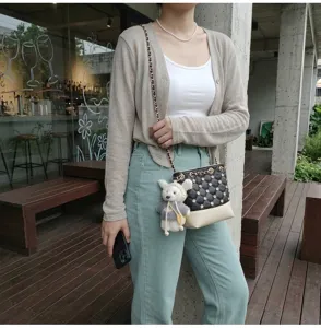 Korean style chic quilted bucket bag with chain strap and cute bear pendant for women.