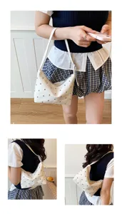 White studded shoulder bag for women, chic hobo purse with metal studs, stylish underarm bag.