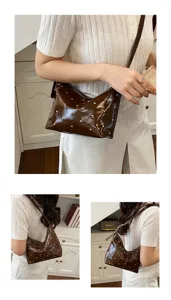 Stylish Korean riveted shoulder bag, glossy brown PU leather underarm bag for women daily commute.