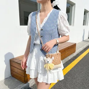 Stylish quilted bucket bag with chain strap and rhinestones, perfect crossbody fashion choice.