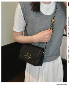 Black quilted shoulder bag for women, chic chain strap design, elegant crossbody purse.