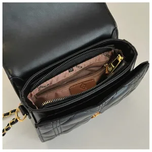 Black quilted chain shoulder bag for women, elegant faux leather crossbody handbag.