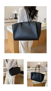 Detail view of a black large capacity leather tote bag, perfect for everyday commuter style.