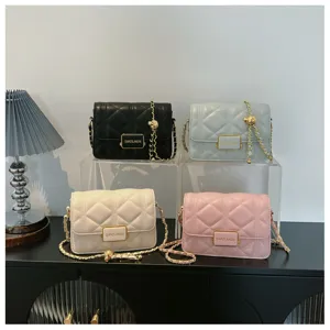 Detailed view of quilted chain shoulder bags in four colors, elegant rectangular design.
