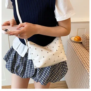 White studded shoulder bag detail, stylish patent leather hobo bag for women daily wear.