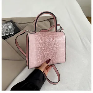 Pink croc embossed Kelly bag detail, retro shoulder handbag with top handle and strap.