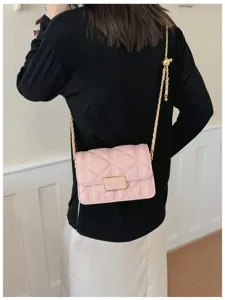 Pink quilted shoulder bag with gold chain strap, stylish chain design crossbody bag detail.