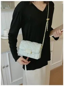 Chic quilted chain shoulder bag for women, stylish crossbody handbag with elegant metal lock.