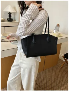Black leather tote shoulder bag for women, large capacity stylish commute handbag for daily wear.