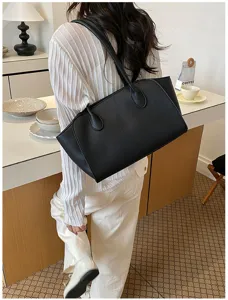 Classic black tote shoulder bag for women, large capacity minimalist commuting handbag.