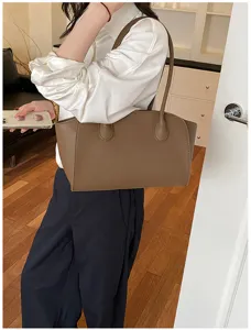 Large capacity brown tote bag, stylish leather shoulder bag for women daily commute use.