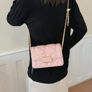 Trendy pink quilted chain shoulder bag for women, stylish crossbody handbag with metal strap.