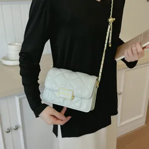 Chic quilted chain shoulder bag for women, elegant light green crossbody bag with metal lock.