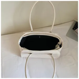 Minimalist white tote bag detail view, spacious shoulder bag for daily commute and casual use