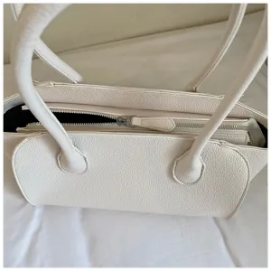 Detail view of white pebbled leather shoulder tote bag, large capacity commuting handbag