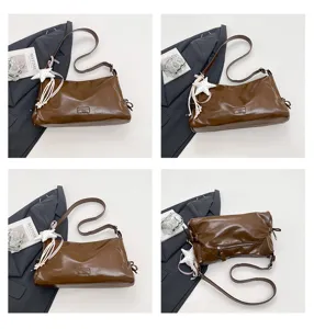 Detail view of retro brown shoulder bag, showing quality PU leather, strap and star pendant.
