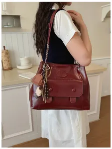 Vintage dark red leather shoulder bag with chain strap, large capacity tote for women.