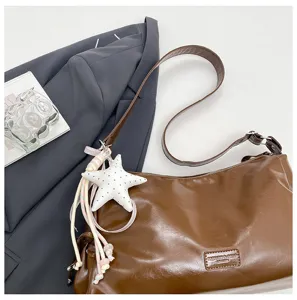 Vintage brown shoulder bag for women, large capacity tote bag with stylish star pendant.
