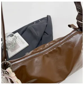 Retro brown patent leather shoulder bag, trendy commuter crossbody bag for women daily use.