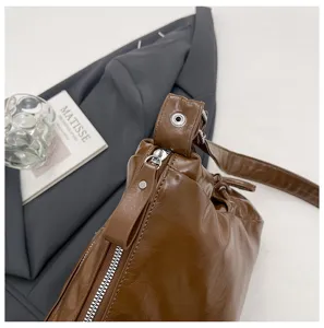 Vintage brown glossy leather shoulder bag, trendy casual crossbody tote for women commuting.