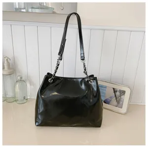 Classic black shoulder tote bag with chain strap, stylish large capacity commuter bag.
