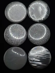 Detailed view of 128g holographic badge backing paper featuring various flash patterns.
